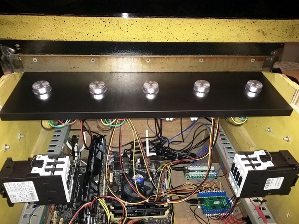 Wooden board with flasher LEDs mounted into the pinball cabinet